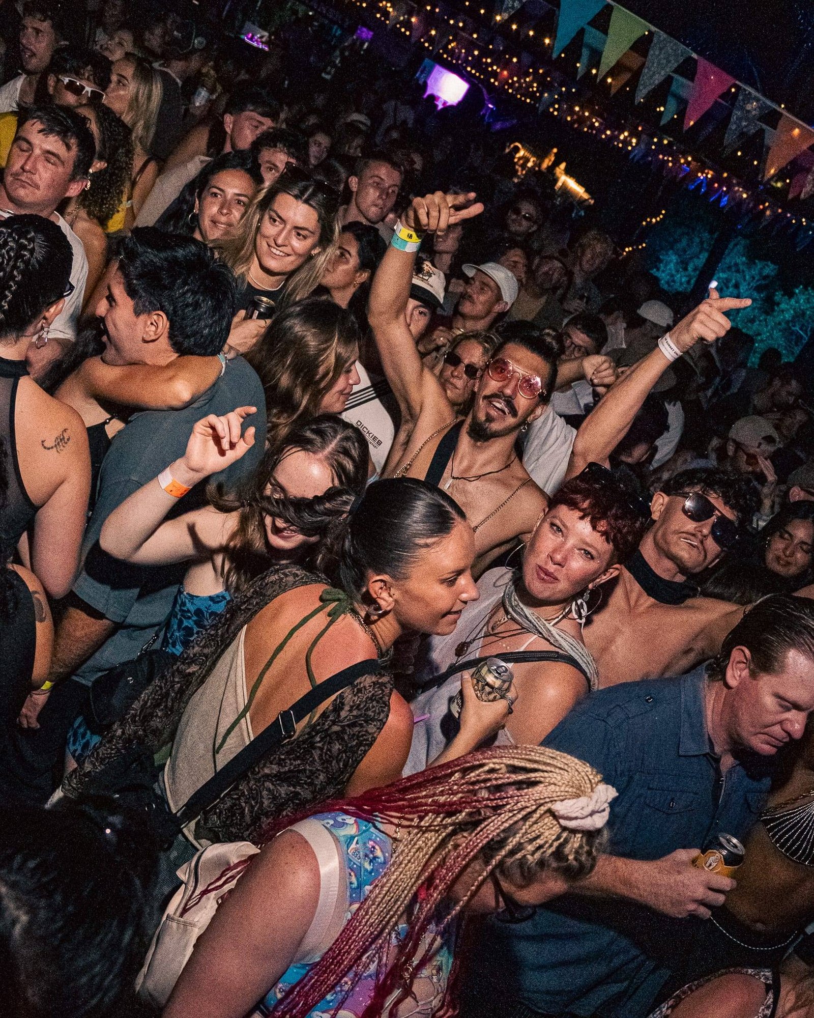 Dancers mid-move on a crowded dancefloor